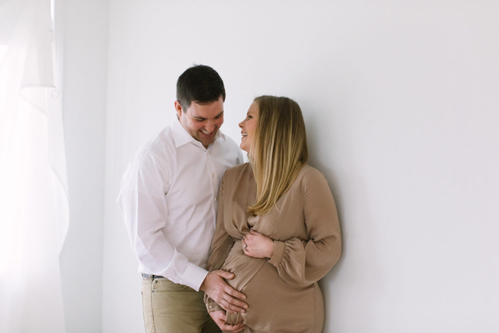 Natural pregnancy photos with a married couple Maternity and newborn photographer Elle Baker Photography
