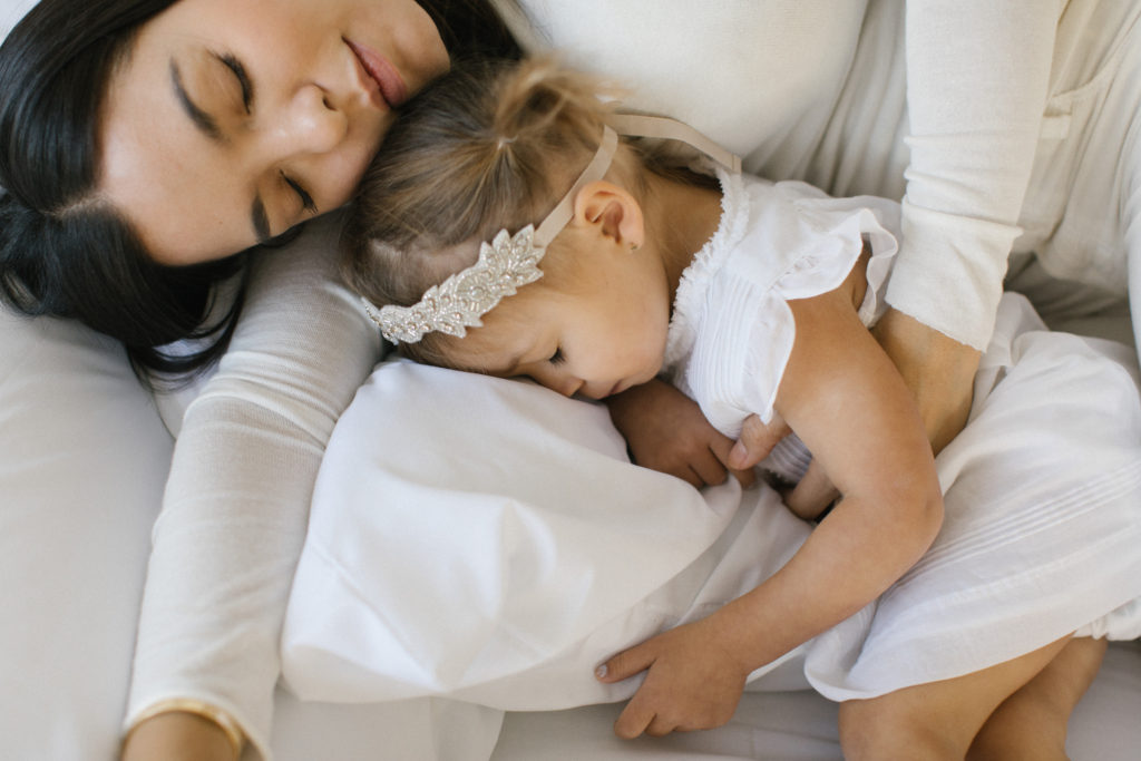 Studio lifestyle session mom and daughter sleeping 