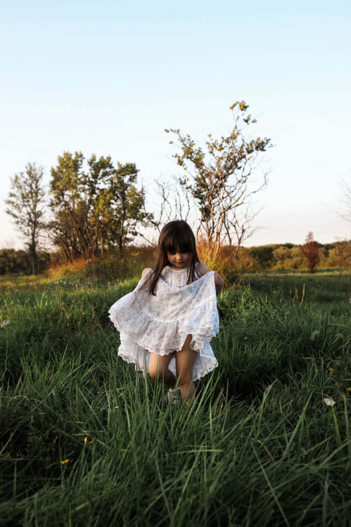 Frankfort Family Photographer girl twirling in dress in field 