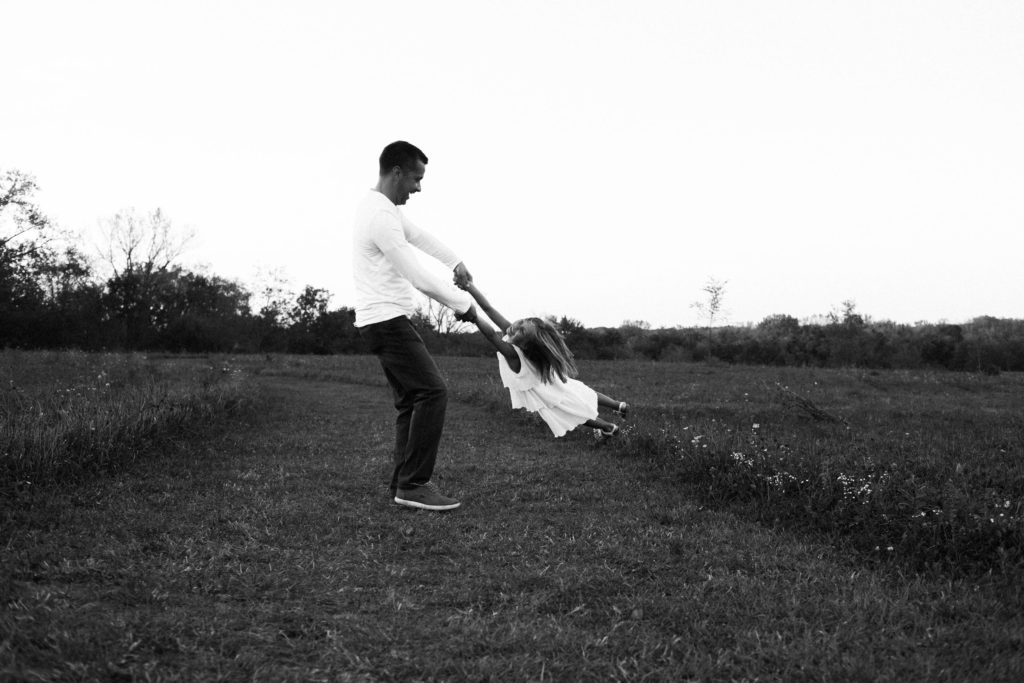 let's go fly a kite | Elle Baker Photography | Father spinning in field 