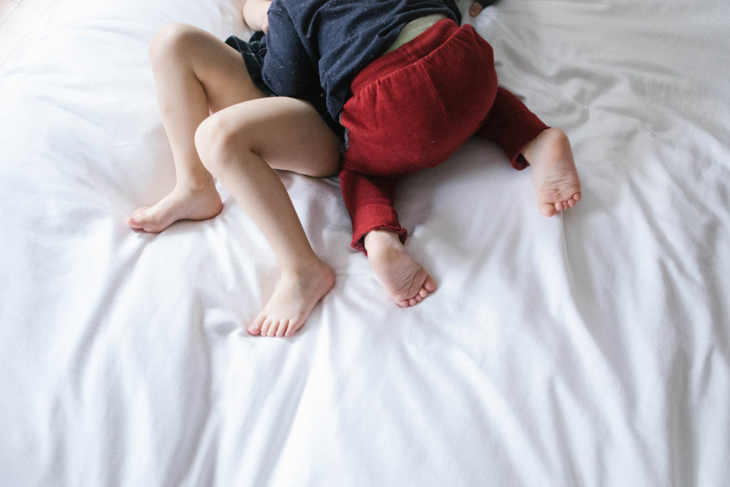 Family time in Lisle IL | Chicago family and lifestyle photographer captures  kids jumping on bed
