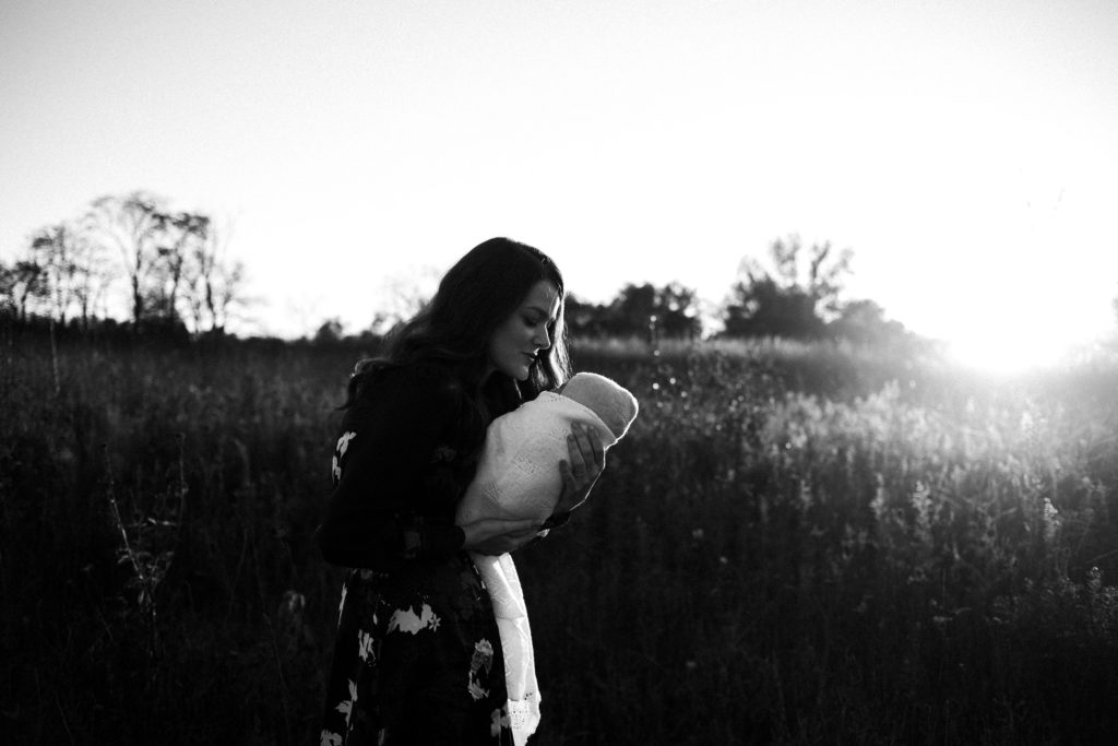 5 Tips on how to shoot during sunset | A golden hour session with a woman and her newborn baby.