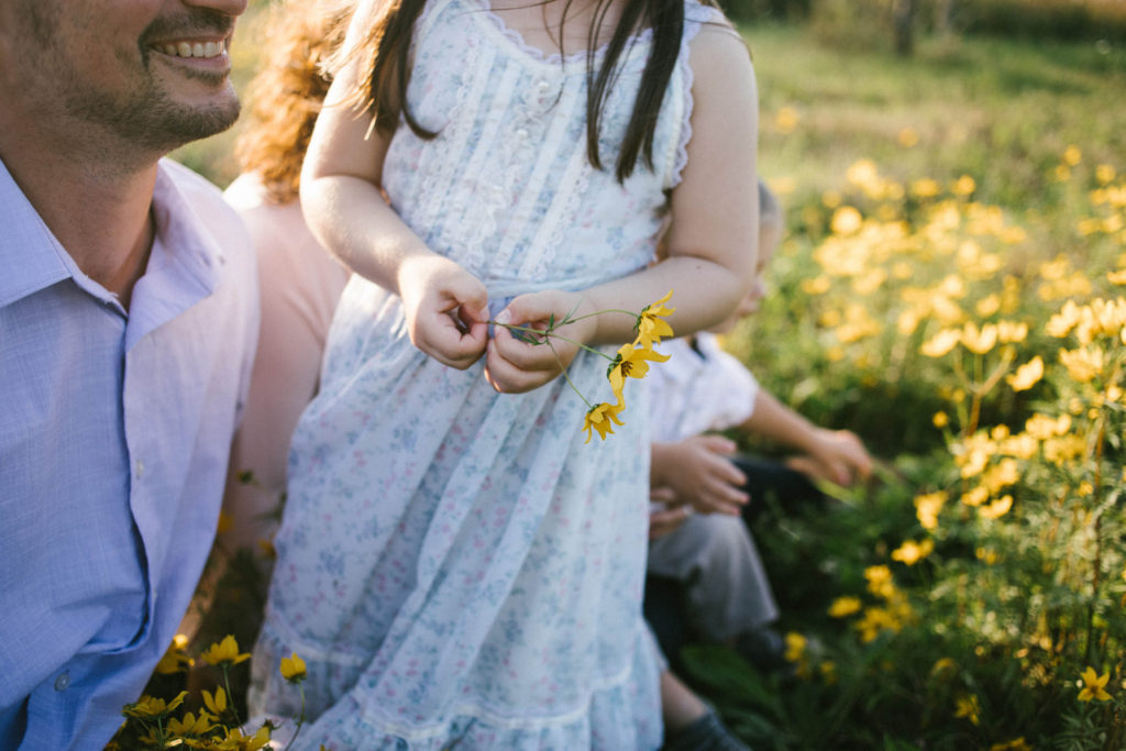 Frankfort Family Photographer little girl holding yellow flowers
