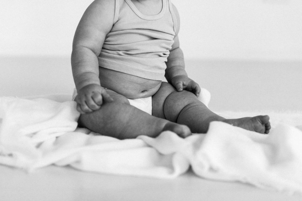 Detail shots during a baby session, Elle Baker Photography, La Grange Illinois baby photographer, baby boy chubby belly in white studio