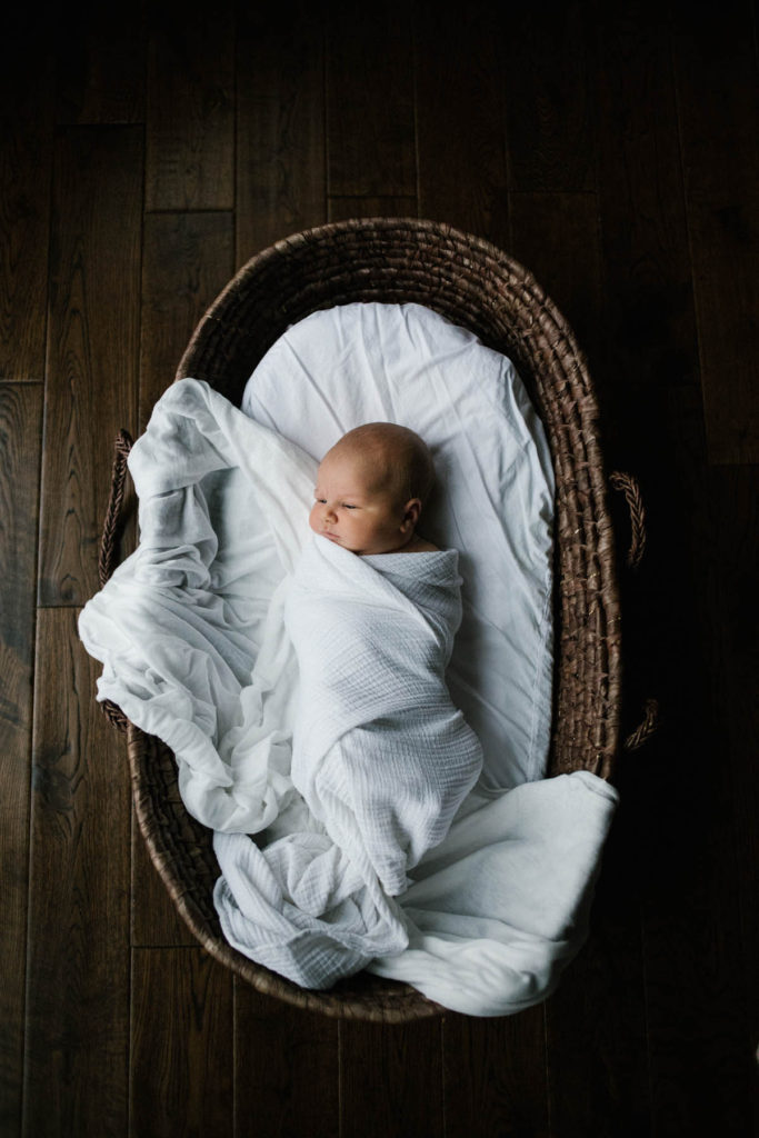 Chicago newborn and family lifestyle photographer, Elle Baker Photography, newborn lifestyle home session and baby is in basket