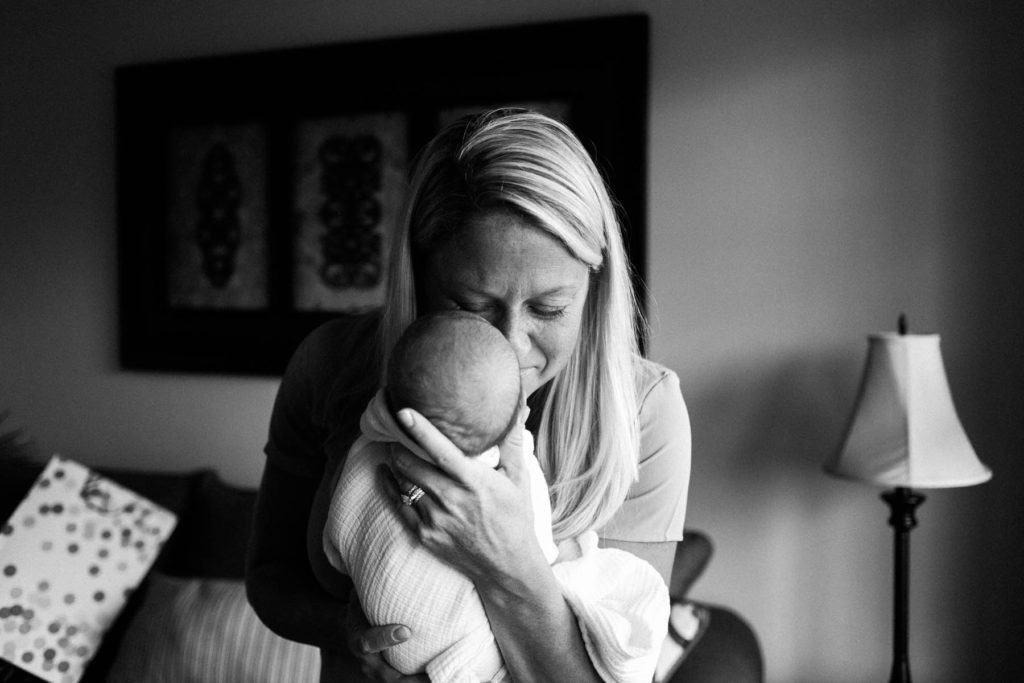 Chicago newborn and family lifestyle photographer, Elle Baker Photography, mom holding newborn baby 
