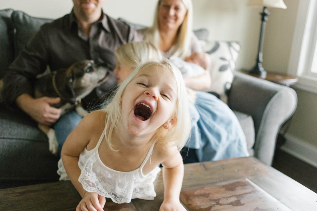 Chicago newborn and family lifestyle photographer, Elle Baker Photography, laughing toddler girl in home session