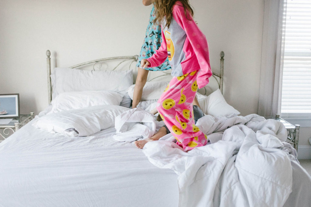 On Saturday's we wear pajamas in New Lenox, IL, Photos by Elle Baker Photography, three children laying in bed playing