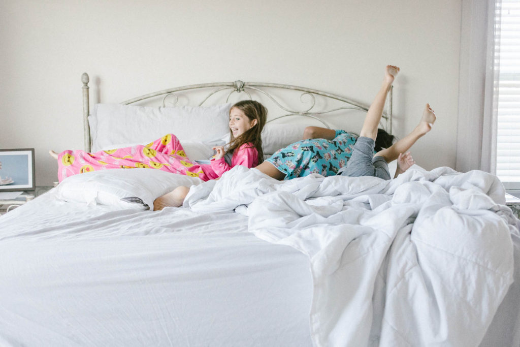 On Saturday's we wear pajamas in New Lenox, IL, Photos by Elle Baker Photography, three children laying in bed playing