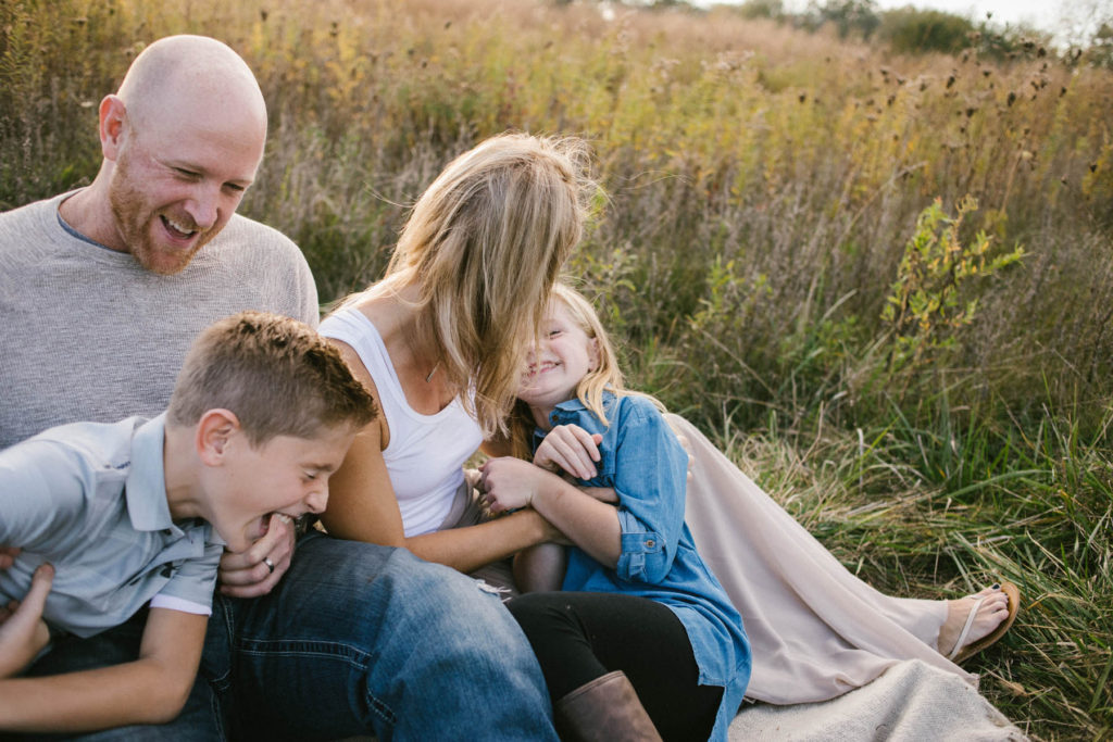 Hickory Creek Junction family session, Photos by Elle Baker Photography, New Lenox IL, family of four laughing in field 