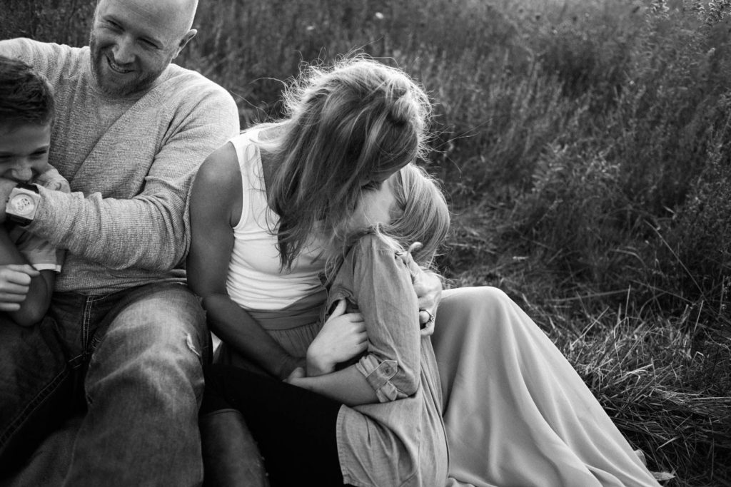 Hickory Creek Junction family session, Photos by Elle Baker Photography, New Lenox IL, family of four laughing in field 