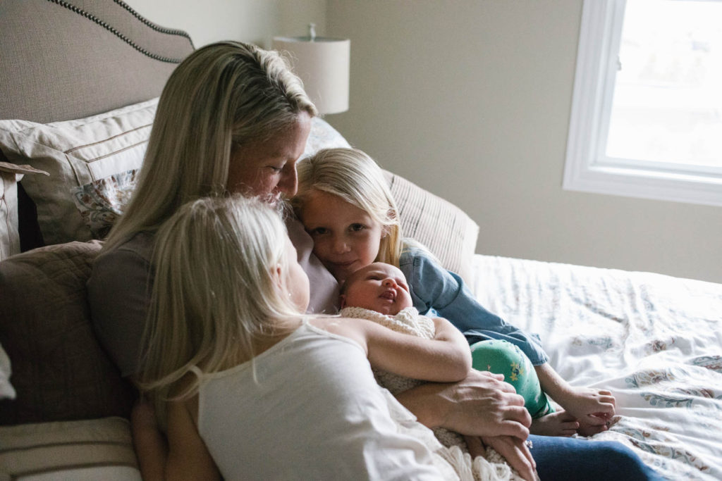 Chicago newborn and family lifestyle photographer, Elle Baker Photography, mother embracing three daughters
