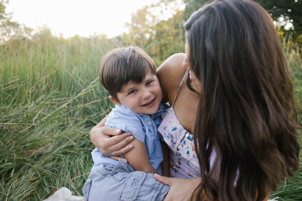 Hickory Creek Preserve in Mokena, IL, Photo by Elle Baker Photography, boy cuddling and smiling with mother during family session