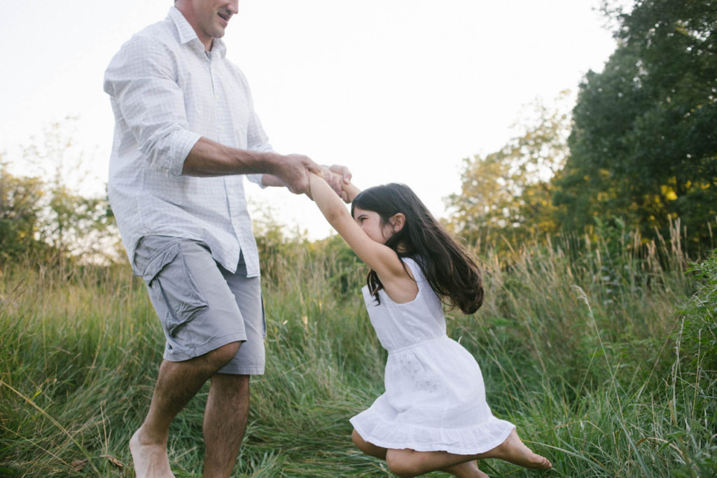 Hickory Creek Preserve in Mokena, IL, Photo by Elle Baker Photography, little girl being twirled by father during candid outdoor family session