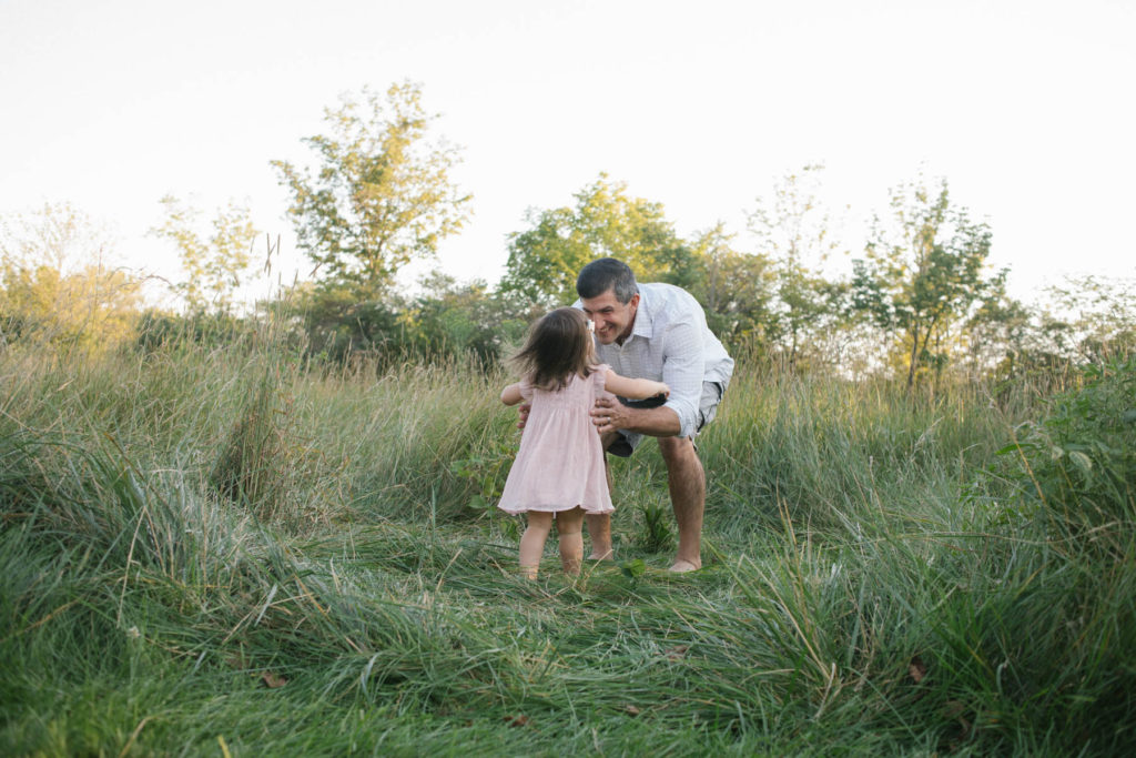 Hickory Creek Preserve in Mokena, IL, Photo by Elle Baker Photography, little girl running to her father during candid lifestyle family session