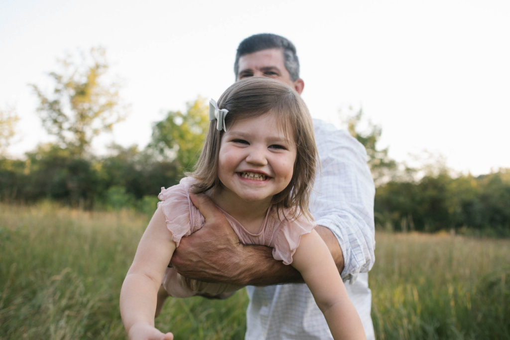 Hickory Creek Preserve in Mokena, IL, Photo by Elle Baker Photography, dad twirling little girl around in a circle during outdoor session