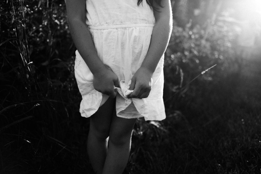 Hickory Creek Preserve in Mokena, IL, Photo by Elle Baker Photography, little girl playing with her dress during candid lifestyle session
