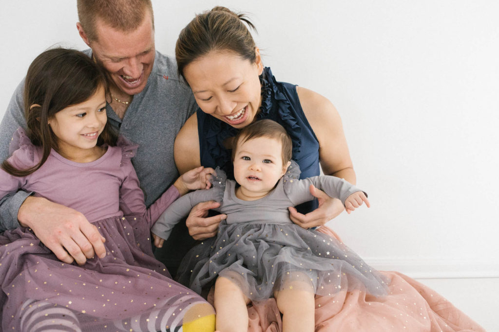 Family Photographer in Naperville, Illinois, Photo by Elle Baker Photography, family of four with sparkly dresses, what to wear for holiday shoot