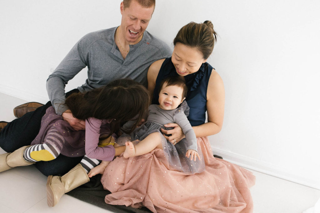 Family Photographer in Naperville, Illinois, Photo by Elle Baker Photography, family of four with sparkly dresses, what to wear for holiday shoot