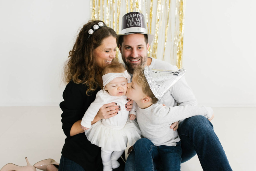 New Year's Photo Session, Photos by Elle Baker Photography, Family of four hugging during studio session