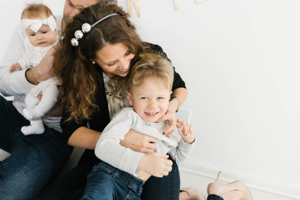 New Year's Photo Session, Photos by Elle Baker Photography, mom tickles little boy during family pose