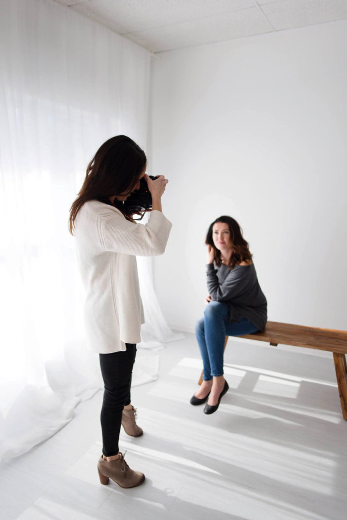 Laurie Baker is one of Chicago's Top Newborn Photographers at Elle Baker Photography. This image shows Laurie behind the scenes shooting headshots