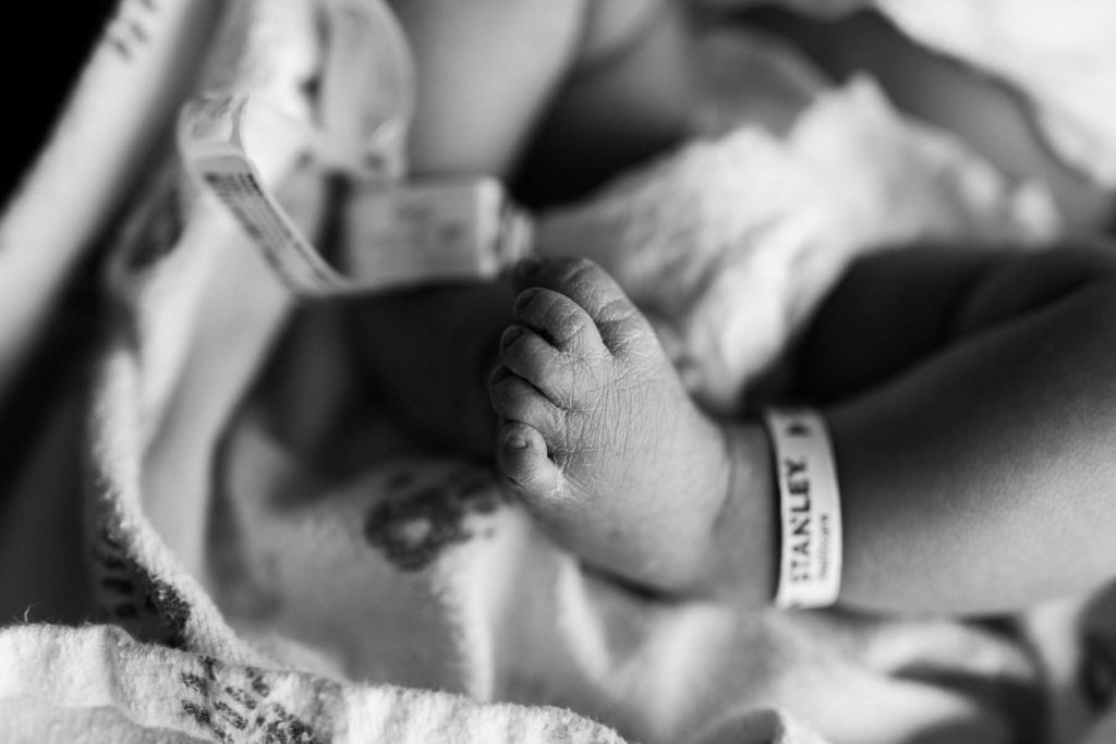 newborn baby feet with hospital bracelets by Elle Baker Photography 