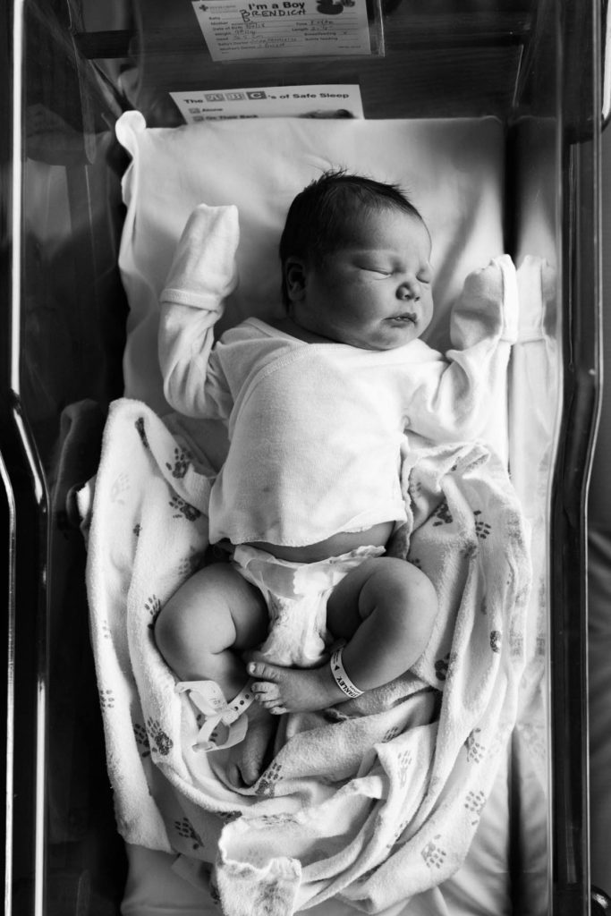 newborn laying in hospital bassinet during Fresh 48 hospital session by Elle Baker Photography 
