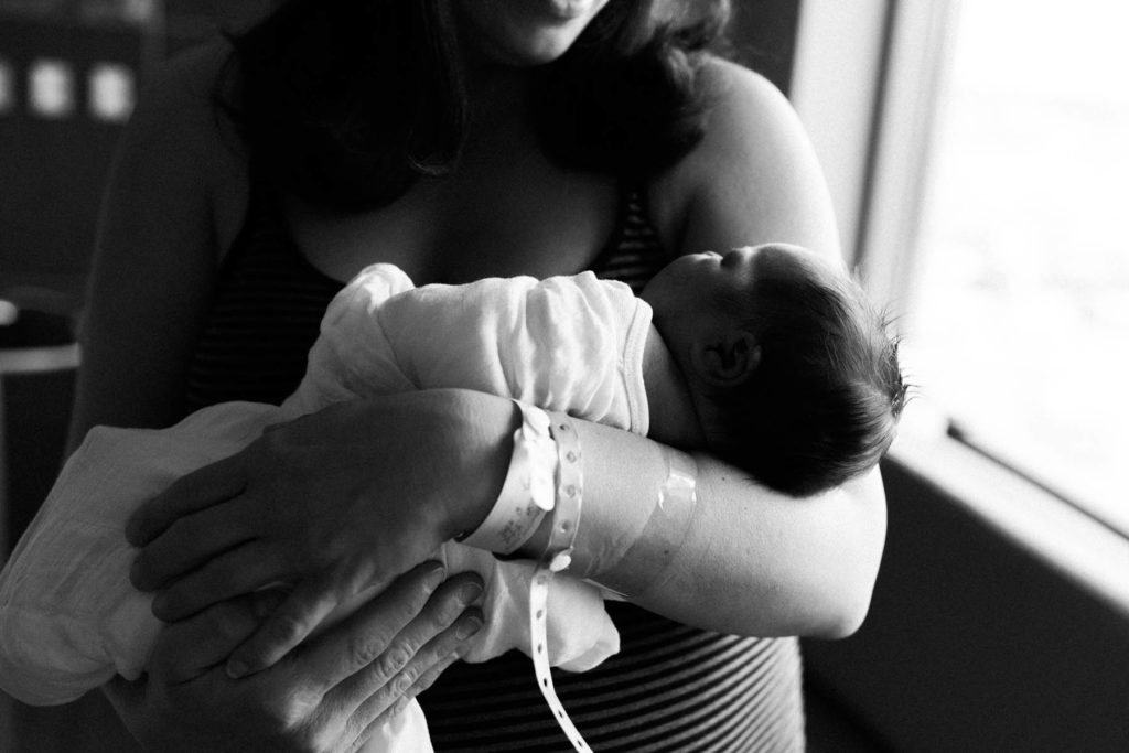 Fresh 48 hospital session with Elle Baker Photography, mother holding newborn baby 