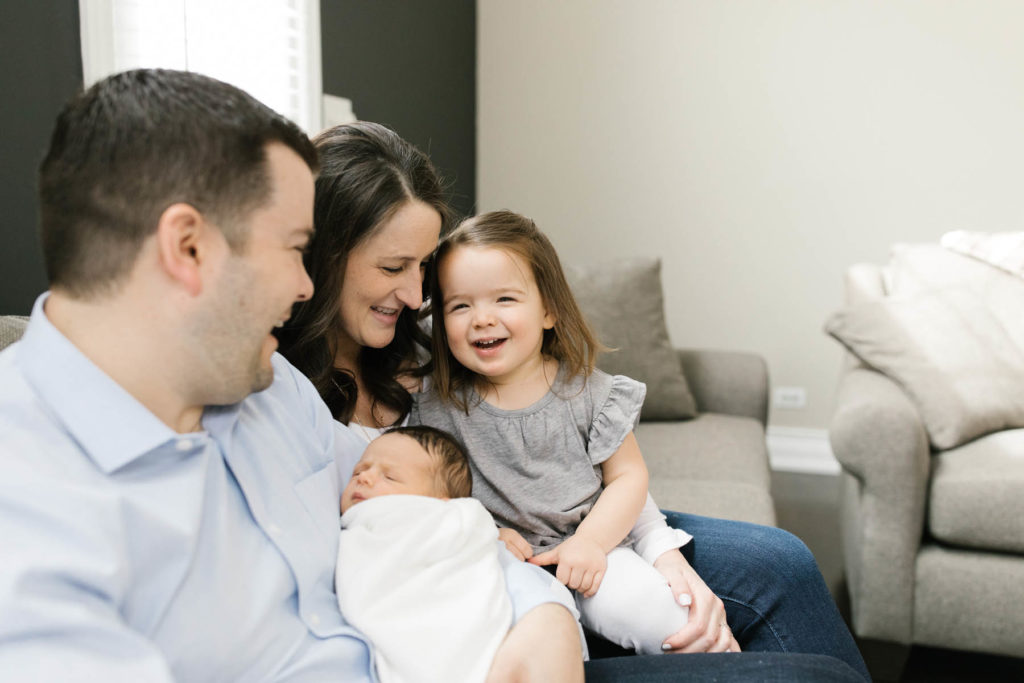 Chicago lifestyle photographer, Laurie Baker captures family of four laughing and hugging