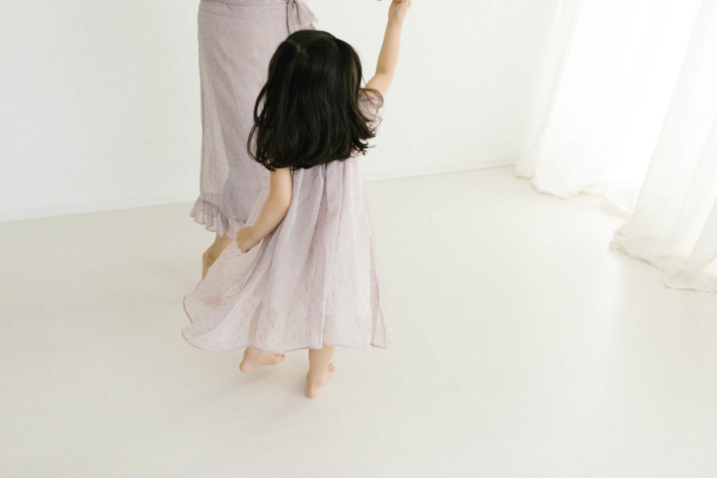 mother dancing with her daughter 