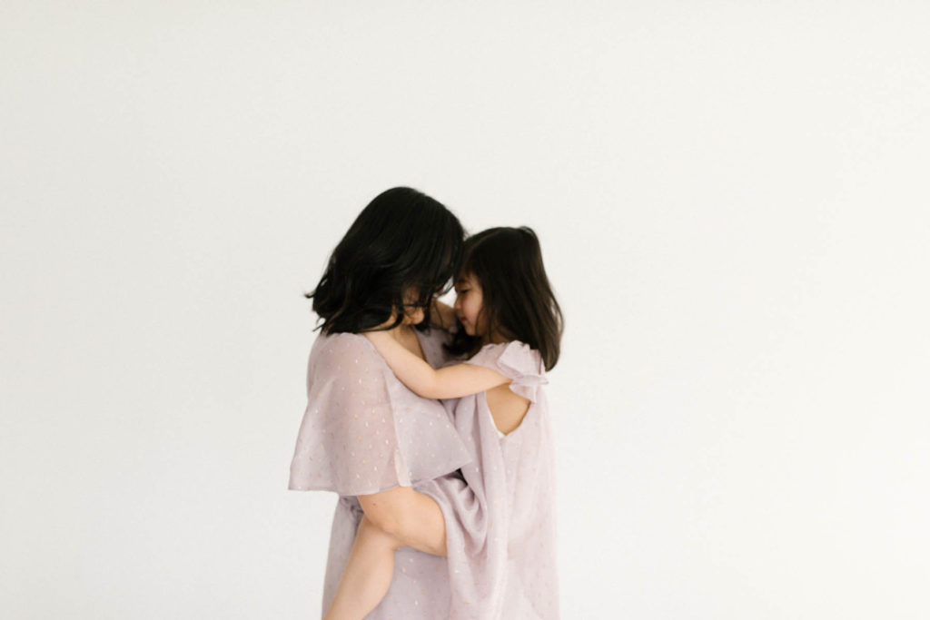 Laurie Baker captures a beautiful mother and daughter wearing matching purple dresses 