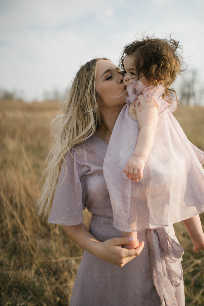 Chicago family portraits by Elle Baker Photography captures mother kissing her baby's cheek