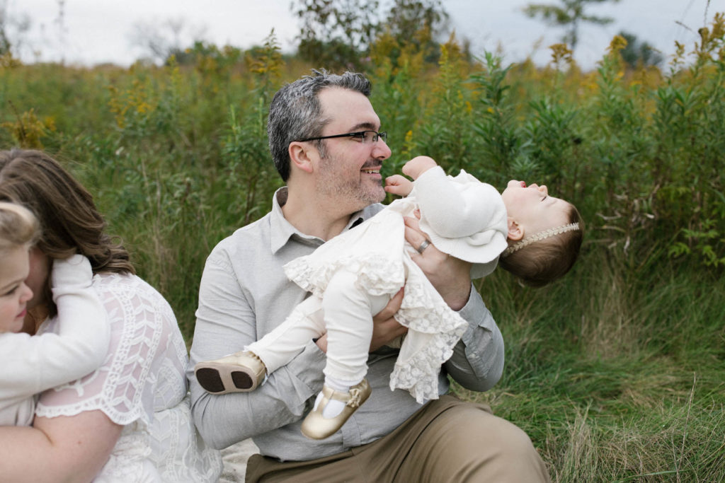 family of three laughing 