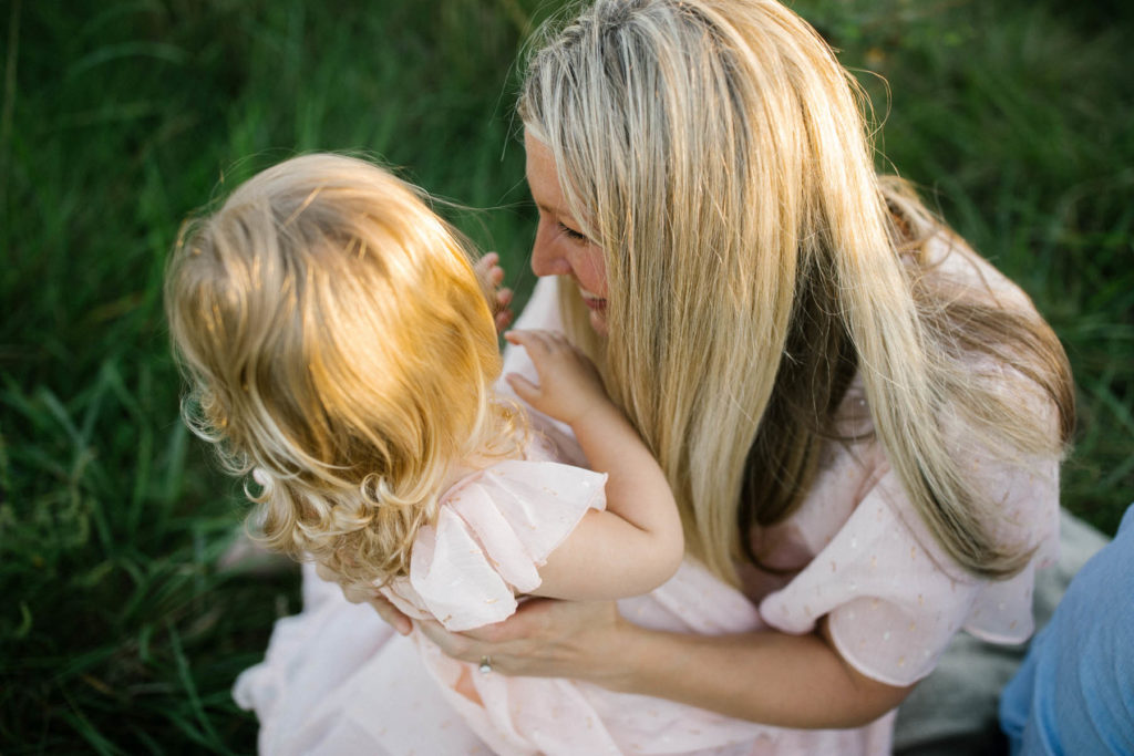 mom giggling with daughter photos by Elle Baker Photography 