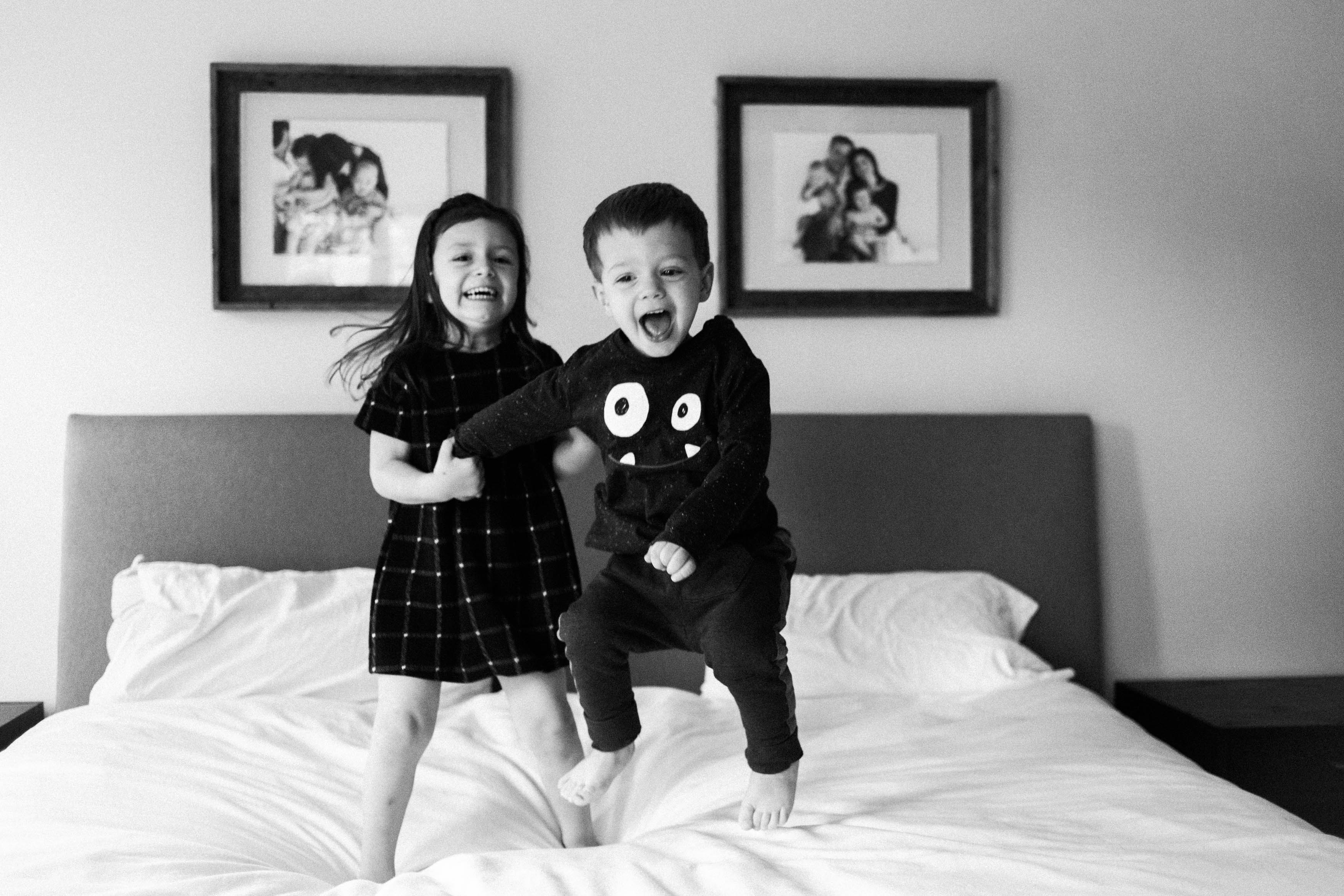 Family time in Lisle IL | Chicago family and lifestyle photographer captures kids jumping on bed