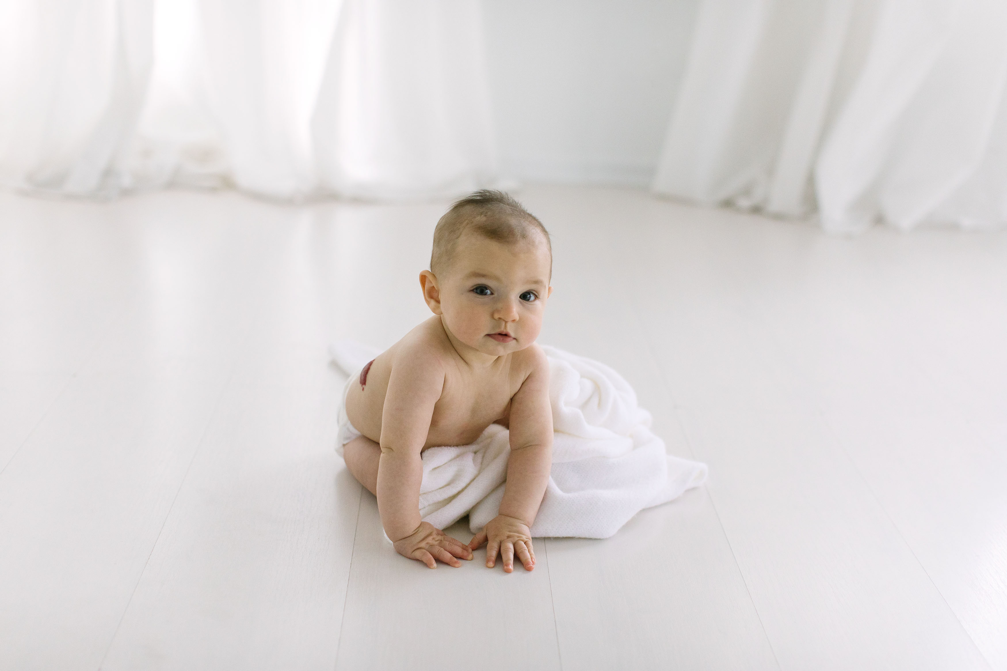 Baby led Sitter Sessions in Homer Glen studio little girl sitting up with white blanket