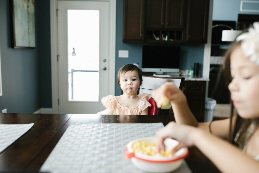 baby girl eating her popcorn