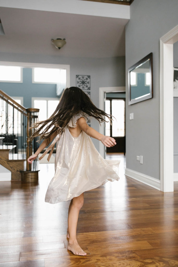 girl twirling in an Elestory dress, photo taken by Elle Baker photography 