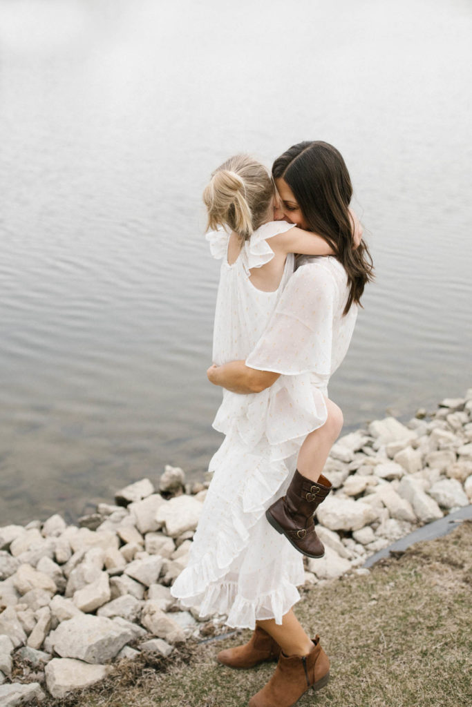 New Lenox Photographer, takes photo of a mother hugging daughter by a pond, Elle Baker Photography 
