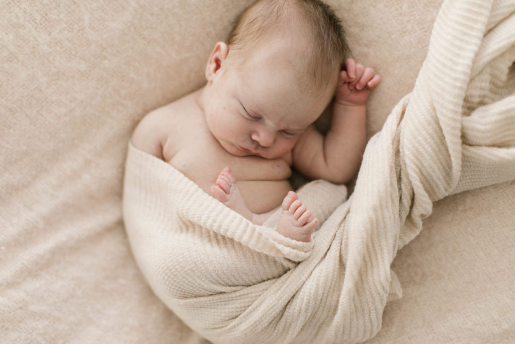 baby girl sleeping during newborn session