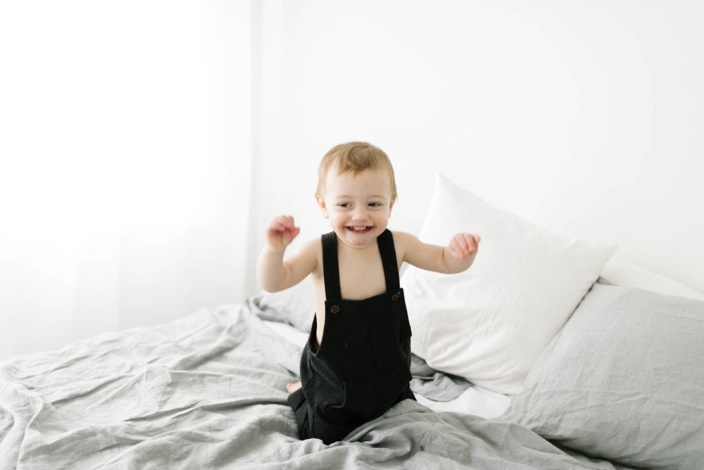 happy baby boy during cute photo shoot 