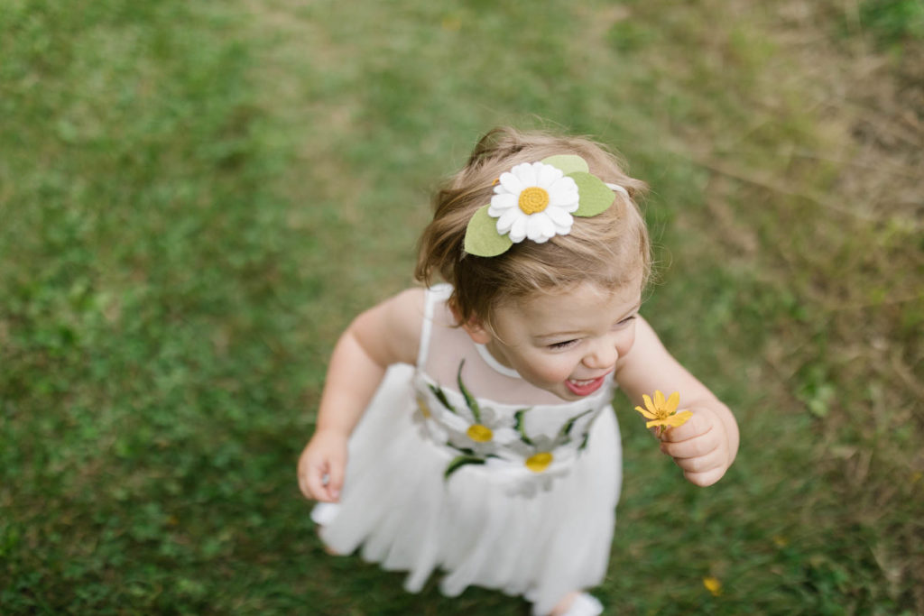 girl running with daisy 