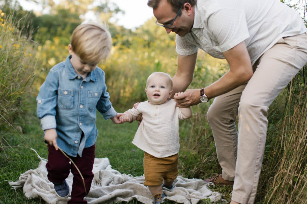 dad toddler and baby boy during fun family photoshoot 