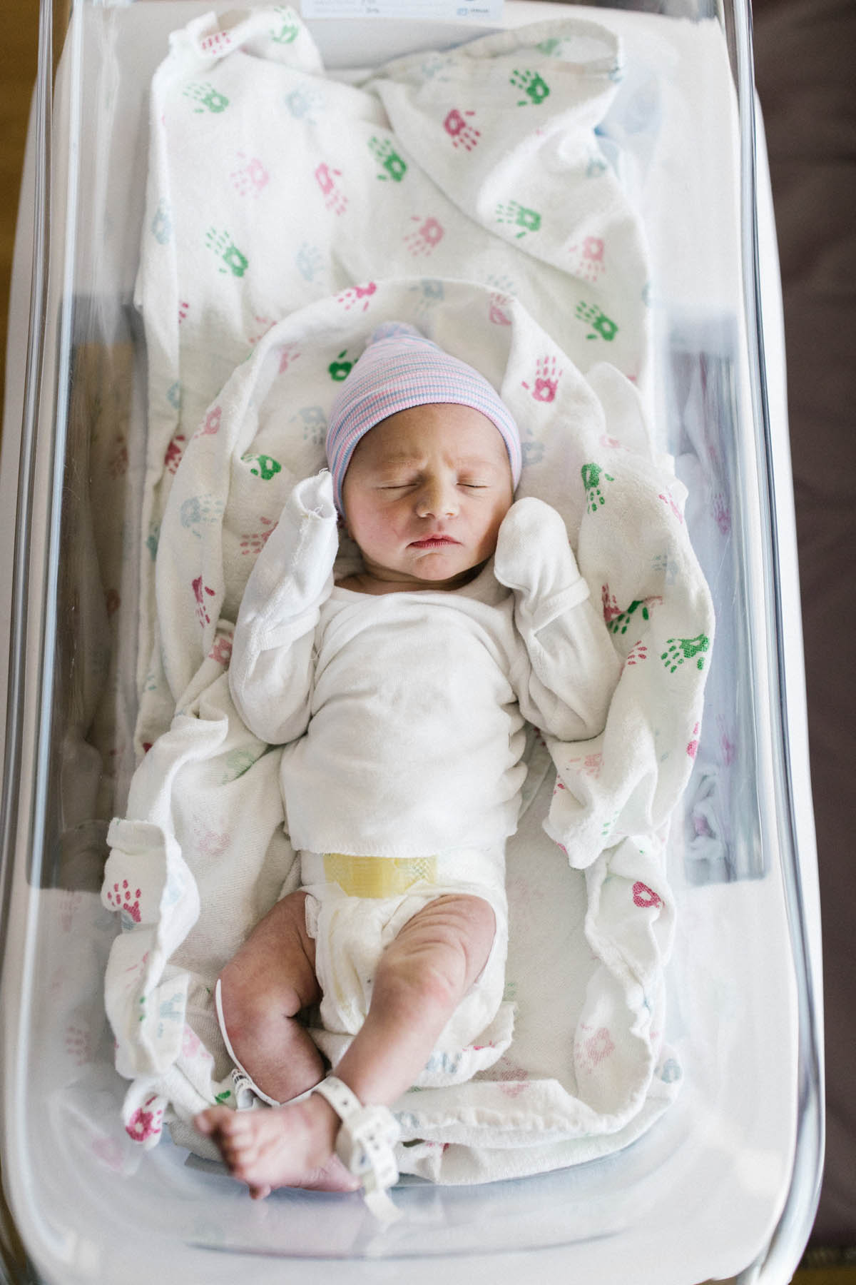 baby boy in clean hospital bassinet 
