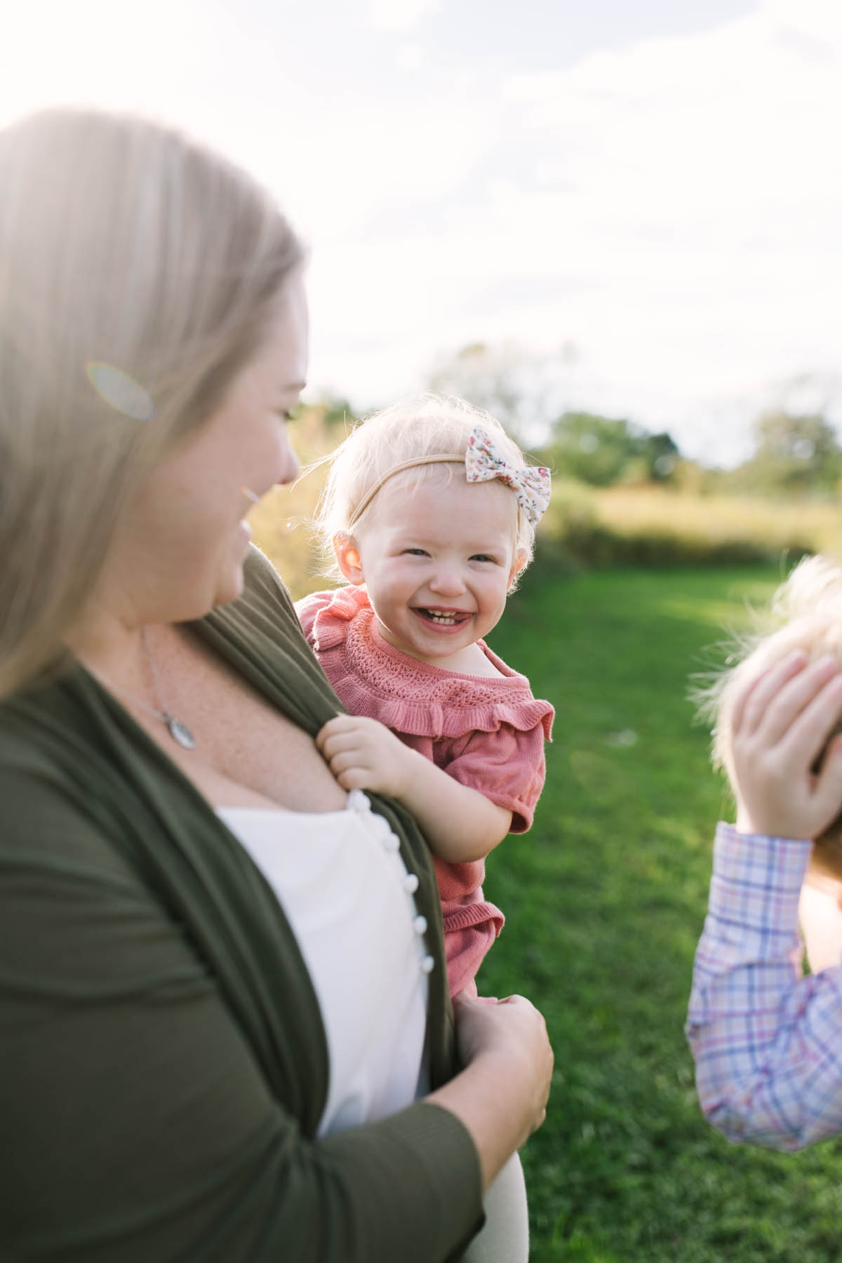 little girl laughs during her New Lenox family photography session 