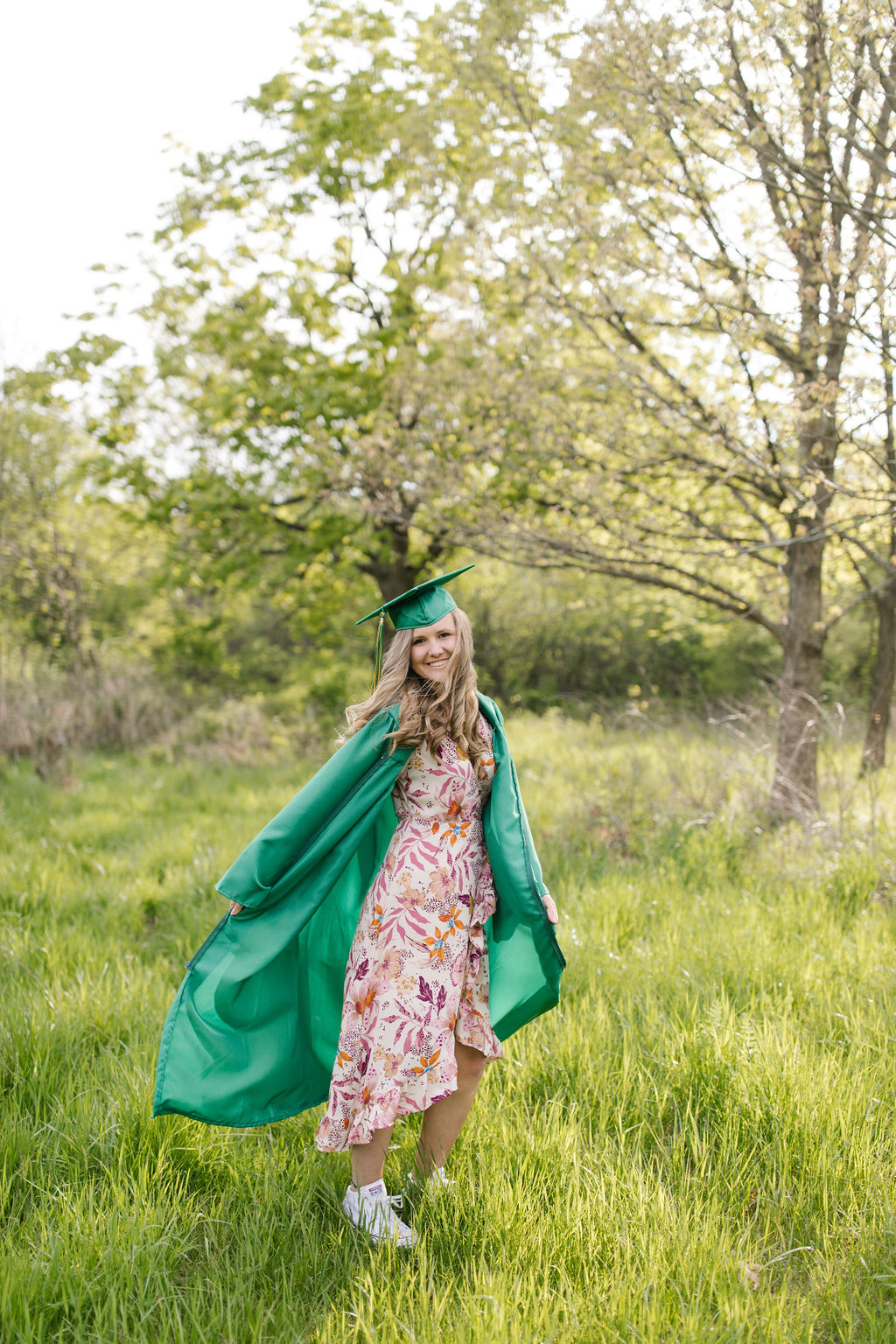 girl spinning in her cap and gown 