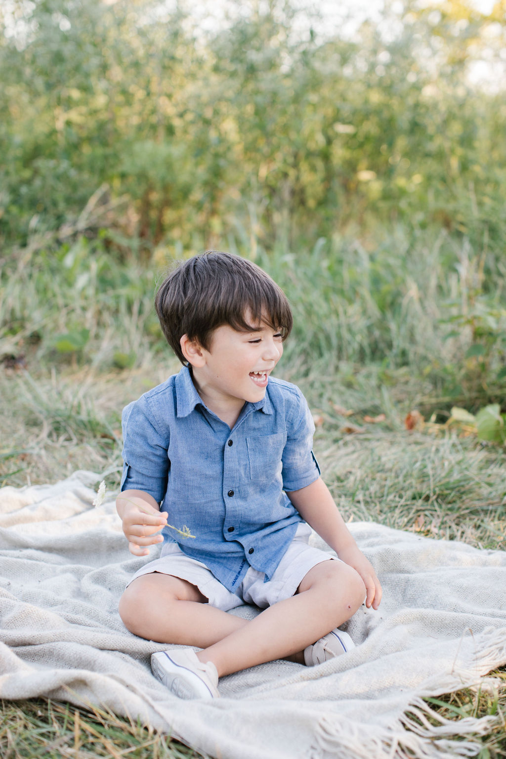 little boy cracking up during photo session New Lenox Family Photographer