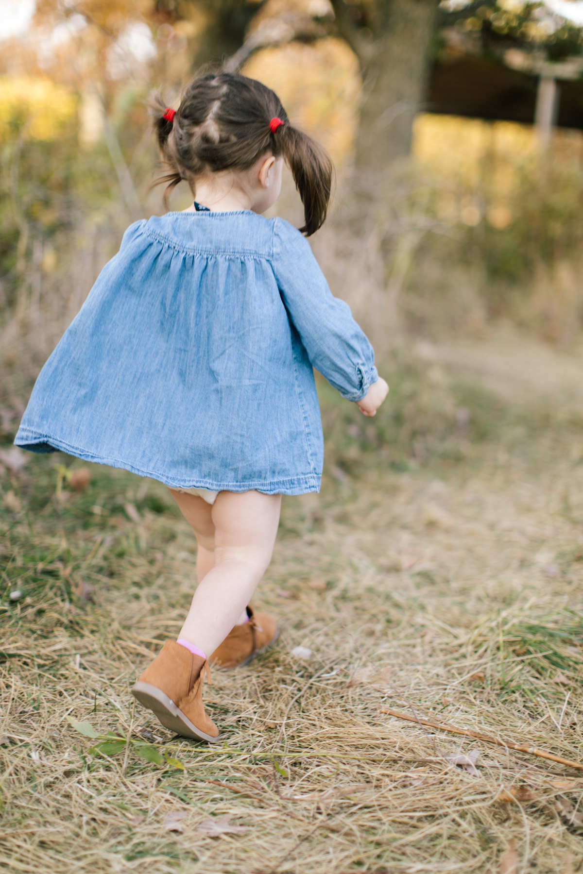 little girl running outside during family mini session
