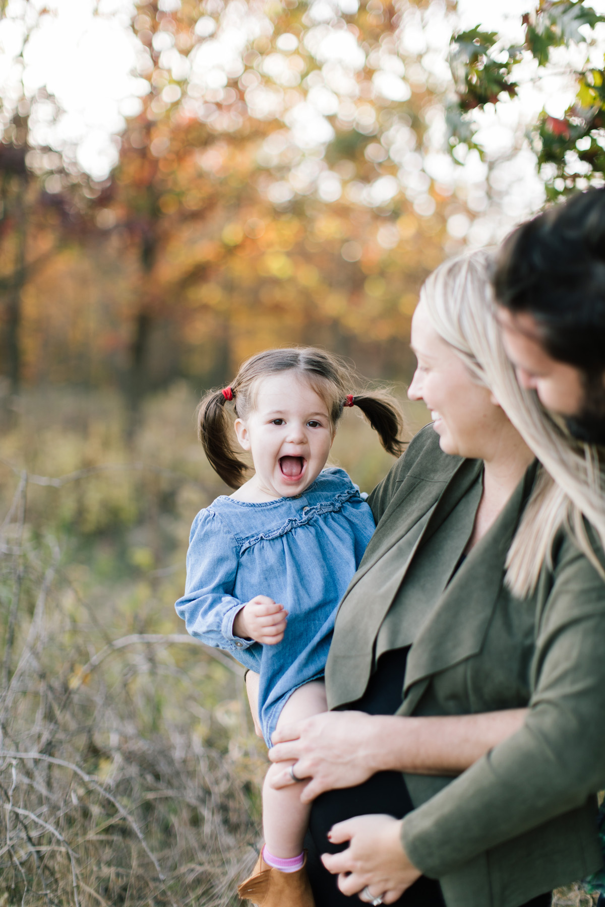 little girl being giggly during family mini session 